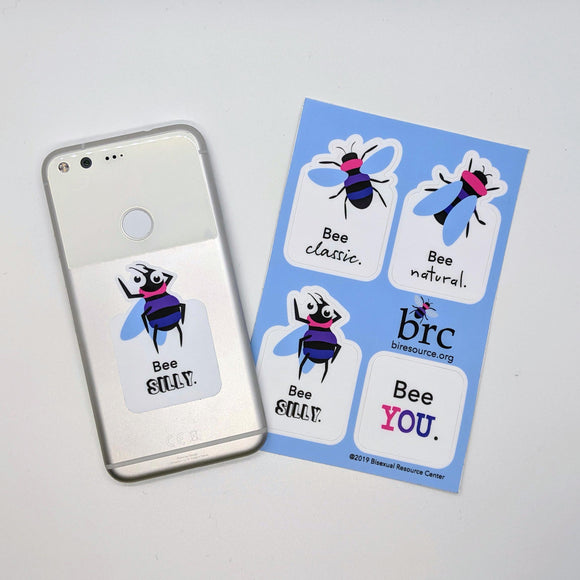 Sticker sheet with four bee stickers, one sticker modeled on back of phone